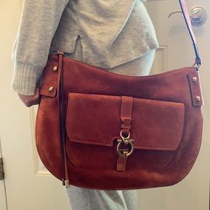 Ferragamo orange suede hobo bag with Gancini clasp